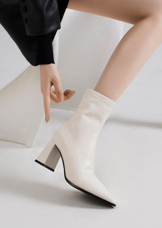 Pointed white high-heeled short boots