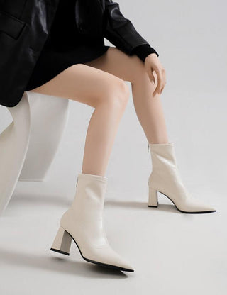 Pointed white high-heeled short boots