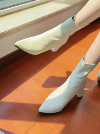 Pointed white high-heeled short boots