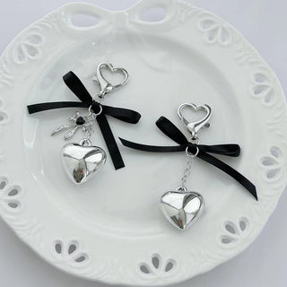 3D silver bow charm