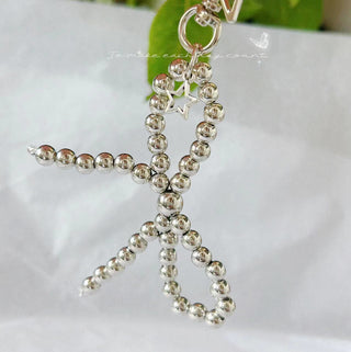 Pearl bows charm