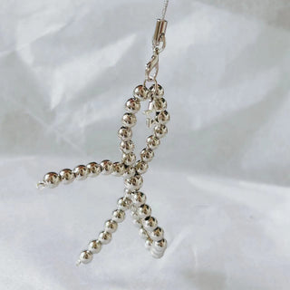 Pearl bows charm