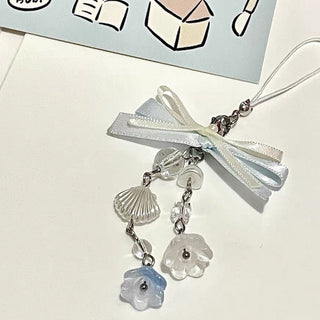 Bow sea shell charm