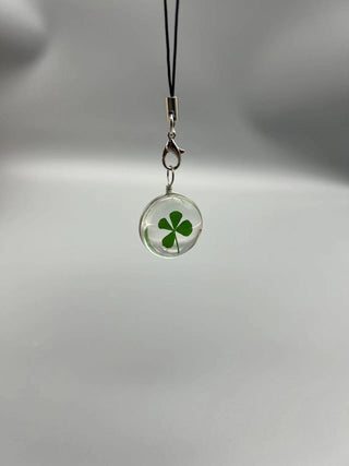 Transparent four leaf clover charm