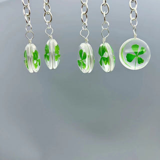 Transparent four leaf clover charm