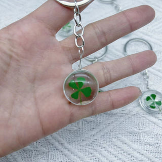 Transparent four leaf clover charm