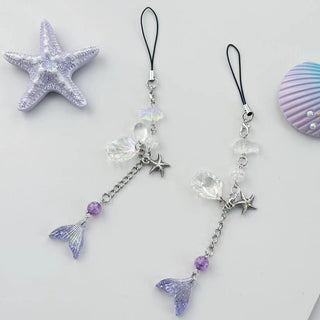 Violet star shell fish charm