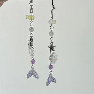 Violet star shell fish charm