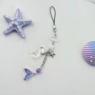 Violet star shell fish charm