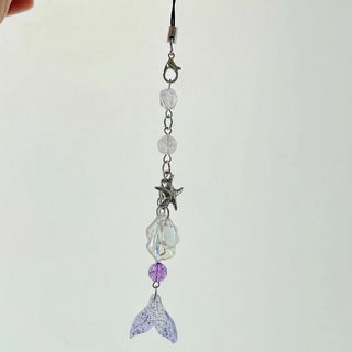 Violet star shell fish charm