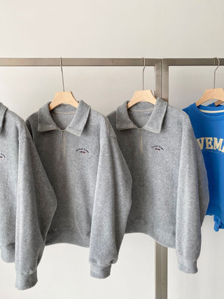 Embroidered quarter zip fleece sweatshirt