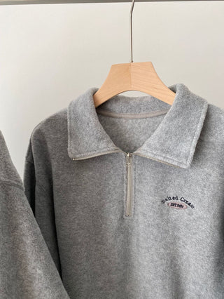 Embroidered quarter zip fleece sweatshirt