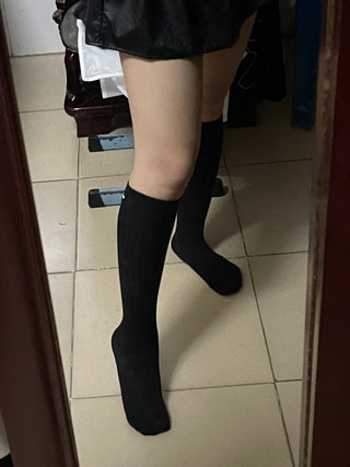 Black label over knee mid-tube socks