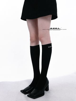 Black label over knee mid-tube socks