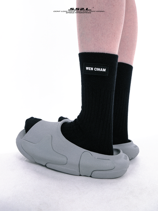 Black label over knee mid-tube socks