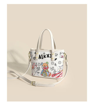 Graffiti graphic cross-handed bag